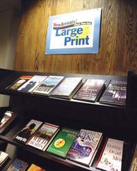 Local libraries have added many new items that assist people with disabilities, including the large-print books shown above from the Nashua Public Library.